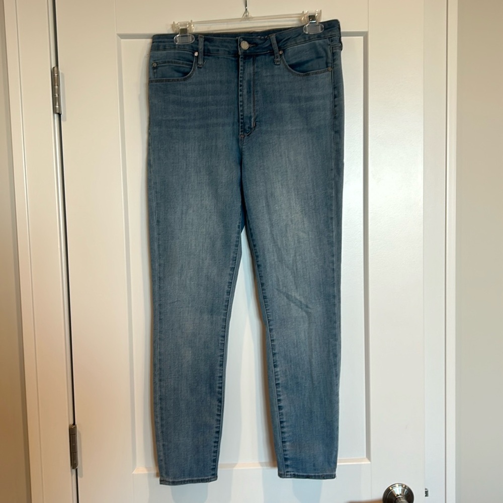 Articles of society size 30 medium wash jeans.